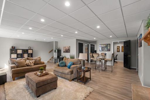Easy care LVP flooring flows through the family room space.