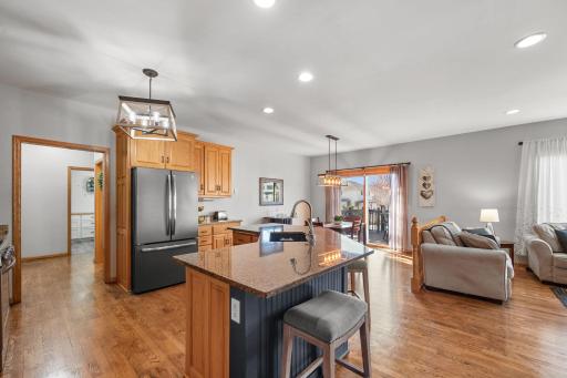 Hardwood Floors, Granite counters and SS appliances are featured in this lovely kitchen.
