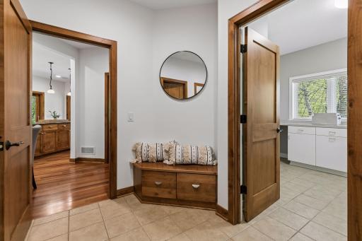 Fabulous mud room with large storage closet and laundry room.