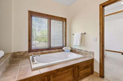 Luxurious jetted tub in the primary bath.