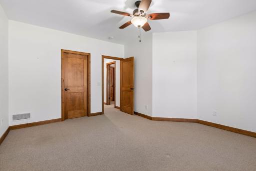 2nd bedroom has a walk-in closet and ceiling fan.