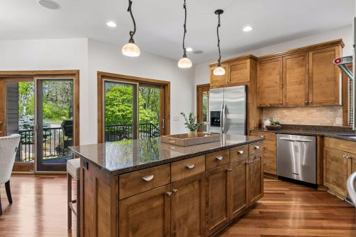 View from the kitchen showing two walkouts to the deck and entrance to the screened porch (on right).