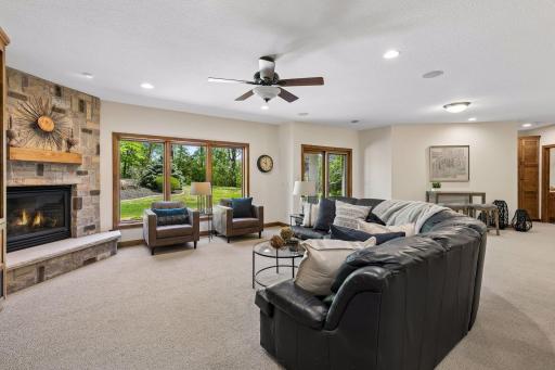 The lower level boasts in-floor heat, in-ceiling speakers and offers convenient walk-out access to the beautifully landscaped backyard.