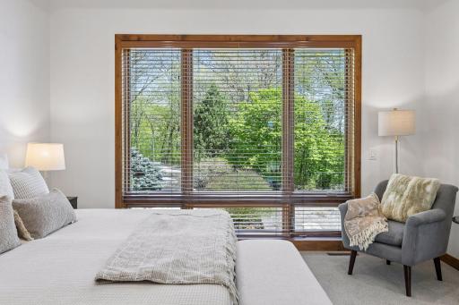 Serene wooded views from the primary suite.
