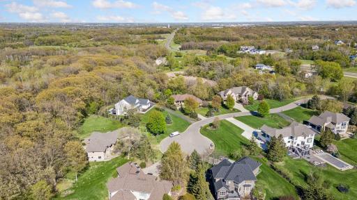 Located just minutes from 35W, restaurants, shopping, and golf courses, this exceptional home is tucked away on a quiet cul-de-sac with mature trees and peaceful wetland views behind - creating a highly sought after setting to call home.