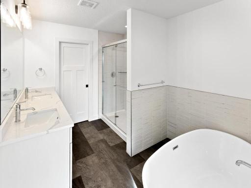 The private owner's bath is a must see with its large soaking tub, tiled walk-in shower, dual sinks and private water closet area.
