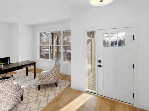 Front entry area is flooded with natural light and features a flex room which is currently setup as a home office.