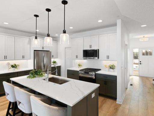 Photo for 2613 Cascade Lane, Long Lake, MN 55356 - listing #7001950 You'll LOVE this awesome kitchen. From the large center island and quartz countertops, to the stylish tiled backsplash and massive walk-in pantry!