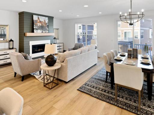 The family room is anchored by the stylish gas fireplace and the room is flooded with natural light!