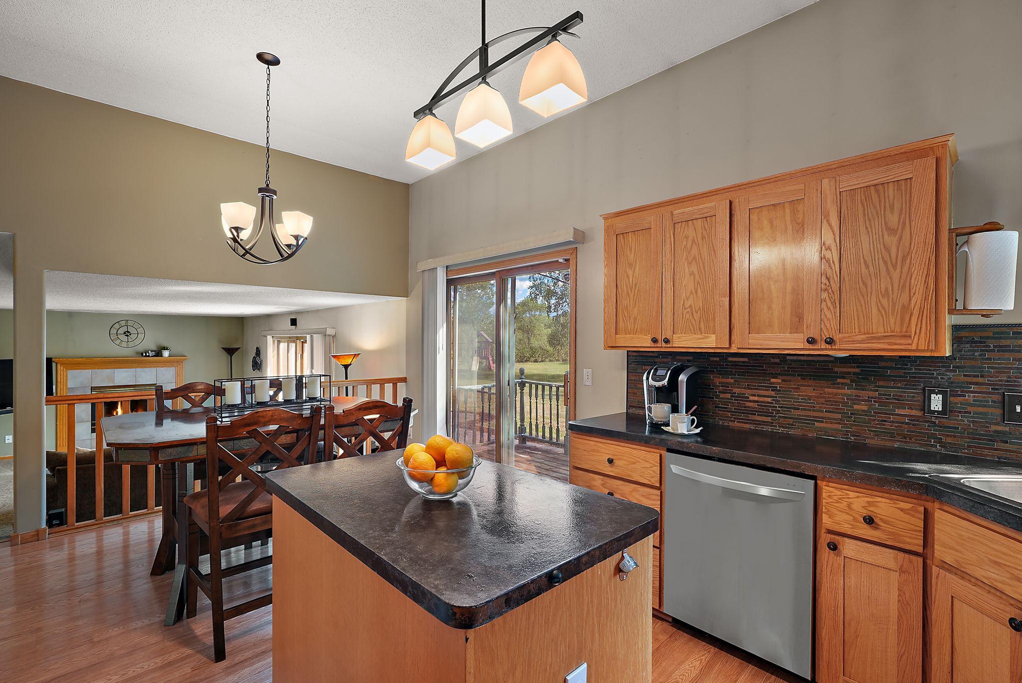 kitchen island/ sliding door that leads to deck