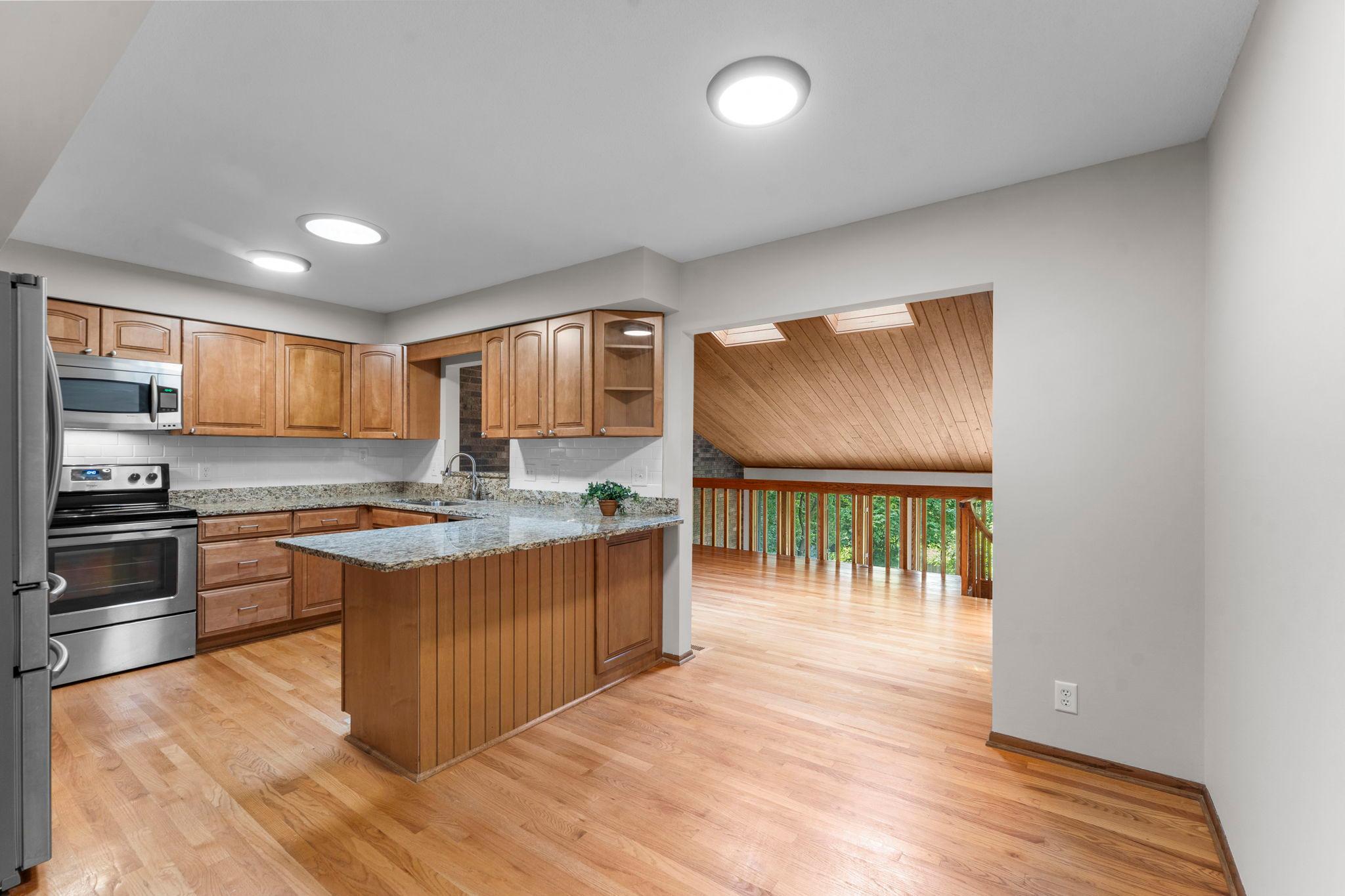 Stainless appliances and granite counters in kitchen