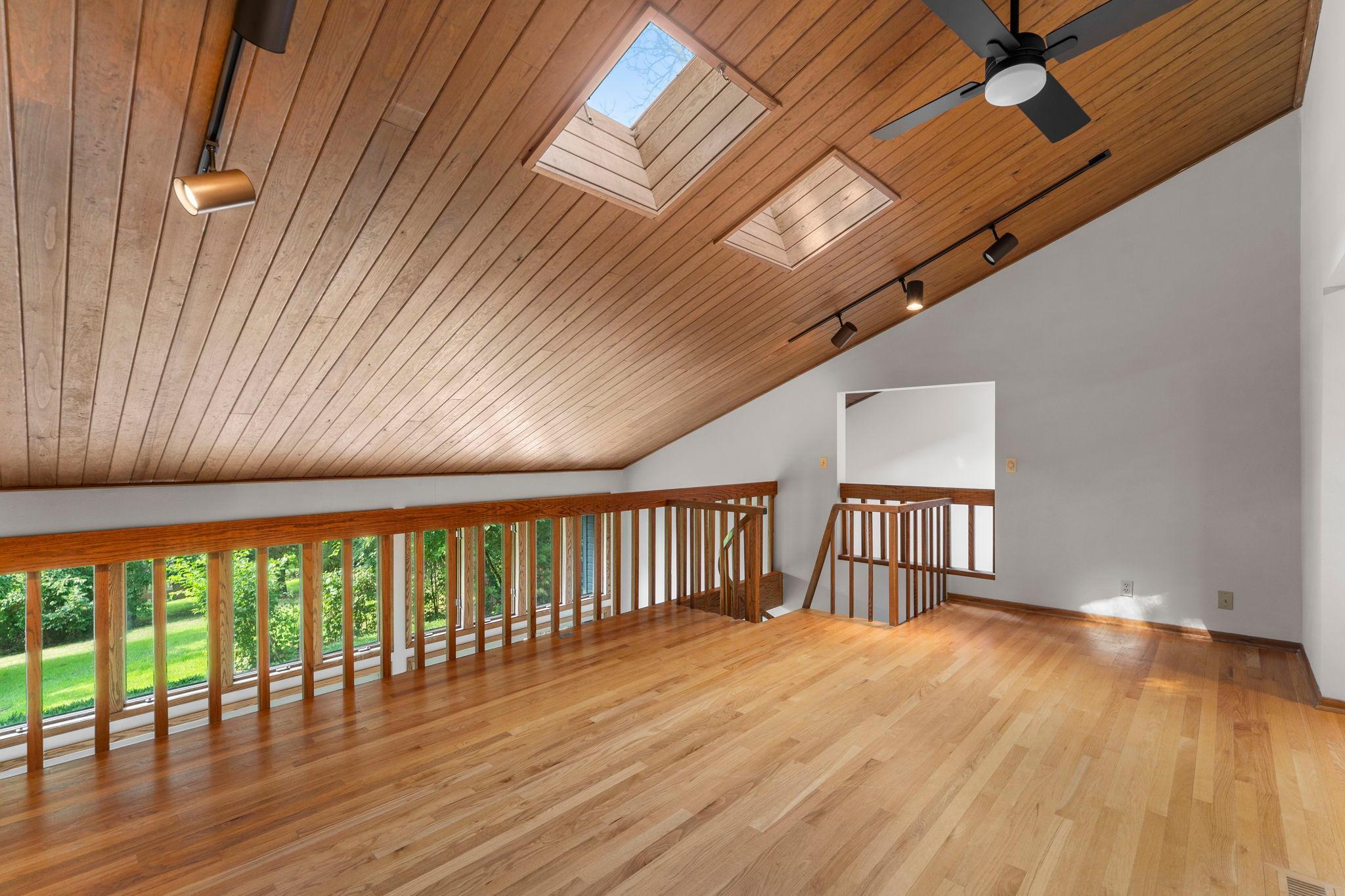 Loft overlooks living room and spa/fitness room