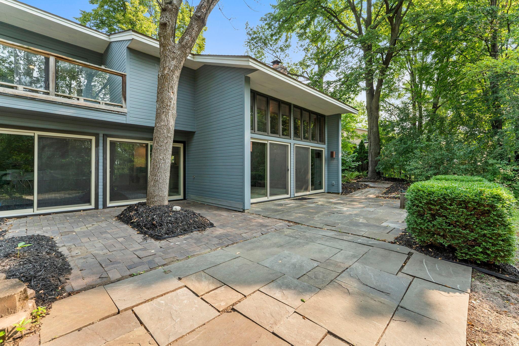 Slate courtyard with sculptured landscaping