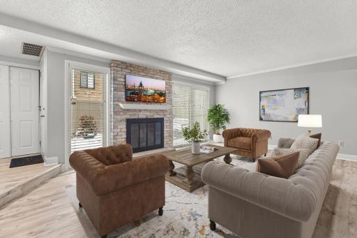 Photo for 4521 Cedar Lake Road S, Minneapolis, MN 55416 - listing #7002179 Spacious living room with wood burning fireplace - virtually staged