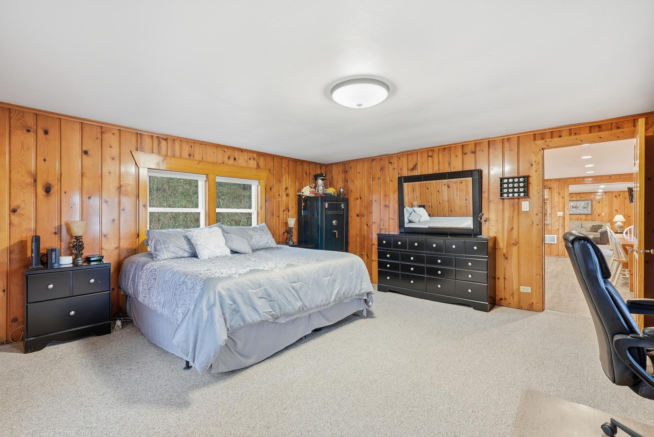 Primary bedroom is spacious and overlooks the lake as well.