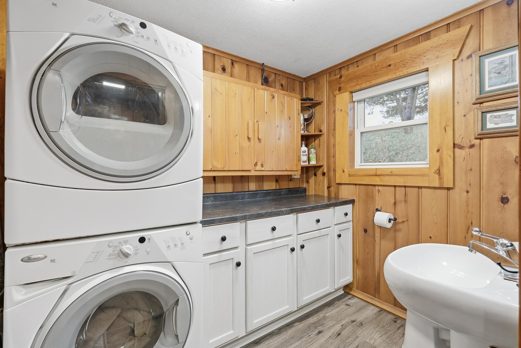 Bathroom with stacking washer and dryer are a huge space saver!