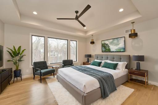 Primary bedroom with private, wooded view - AIG