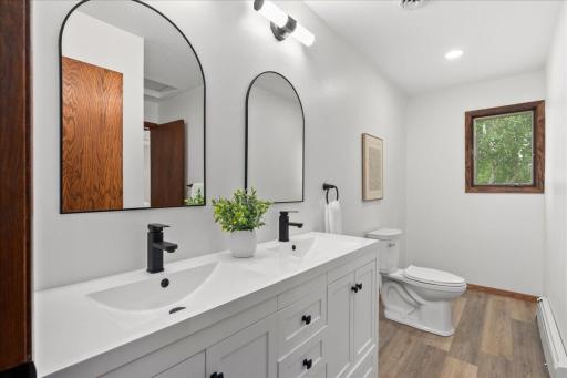 Walk through bath connects to both primary bed and hall.