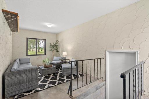Breezeway between the home and garage is a great space for a morning cup of coffee or a good book!