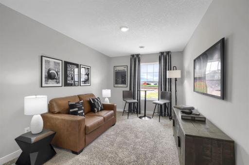 The upper level loft provides the perfect retreat or additional entertaining space. (Model photo, colors may vary)