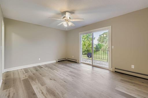 Primary Bedroom W/ View of the Deck and Backyard
