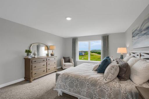 The large primary suite offers a welcome retreat with ample space for furniture arrangements to make it cozy and comfortable. Model photos. Options and colors will vary.