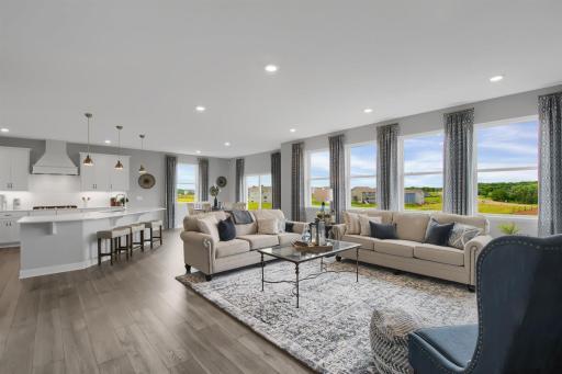 This wide-open concept floor plan is flooded with natural light and perfect for entertaining or relaxing! Model photos. Options and colors will vary.