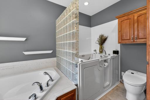 Primary bath with whirl pool tub and walk in tub and heated duby toilet seat