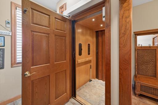 Elevator access in laundry room access the garage to main level and to basement 950# capacity.