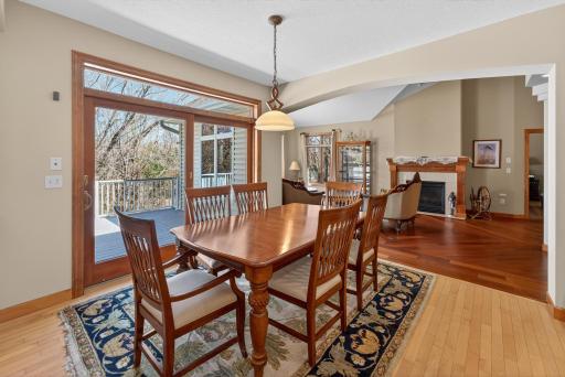 Informal dining room off kitchen with oak hardwood flooring. Patio doors to the deck