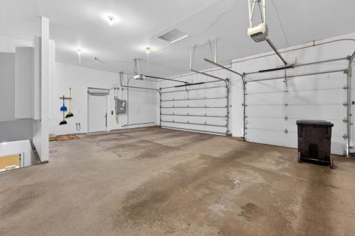 Attached garage with access stairway to basement - door to elevator