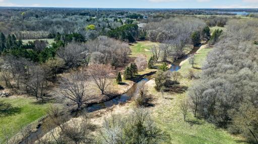 Enjoy the view of Coon Creek running through your property.