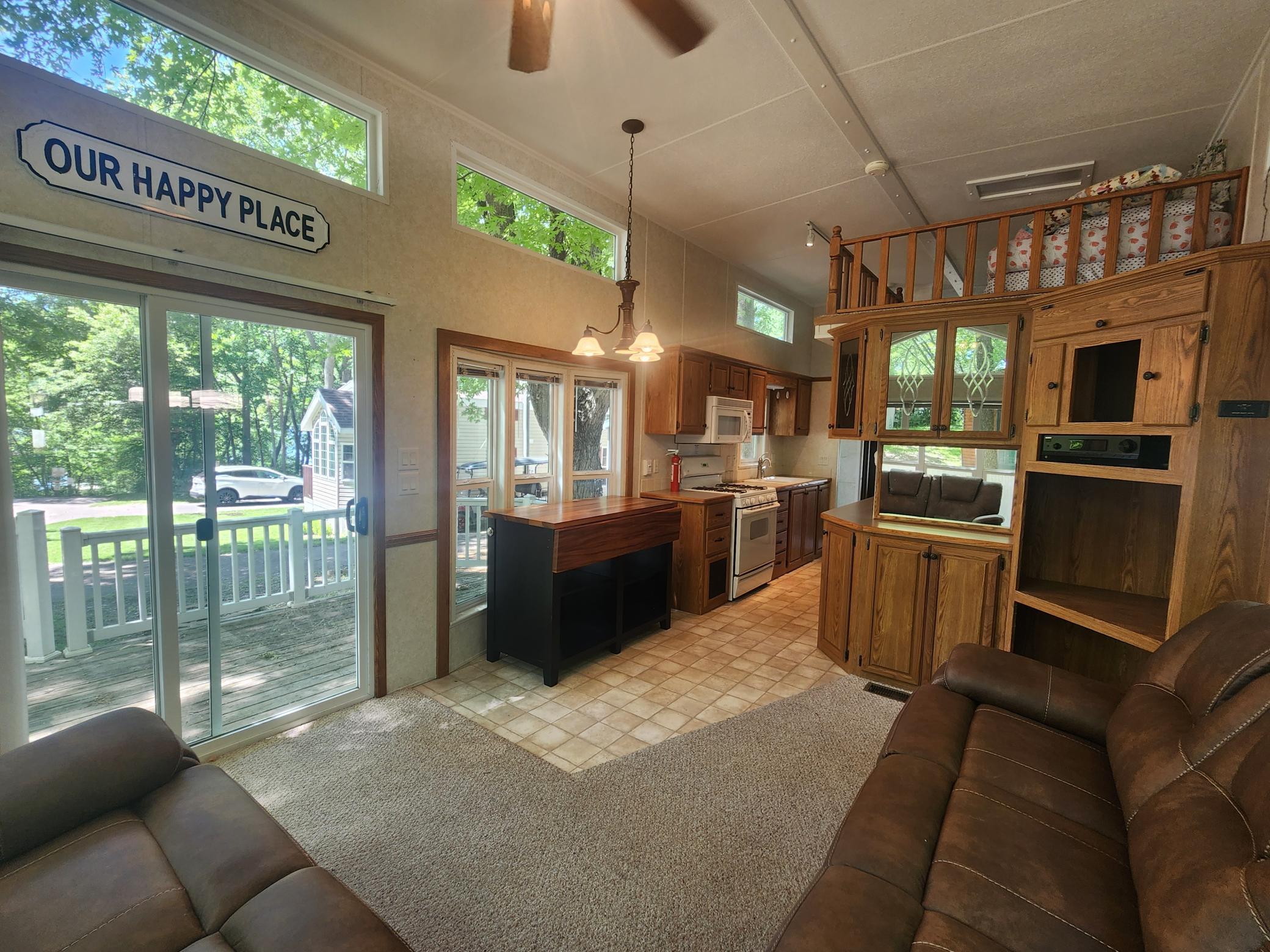 Cokato Lake RV Resort Unit 118 Lofted Park Model, Deck, Shed with peek-a-boo view of Cokato Lake