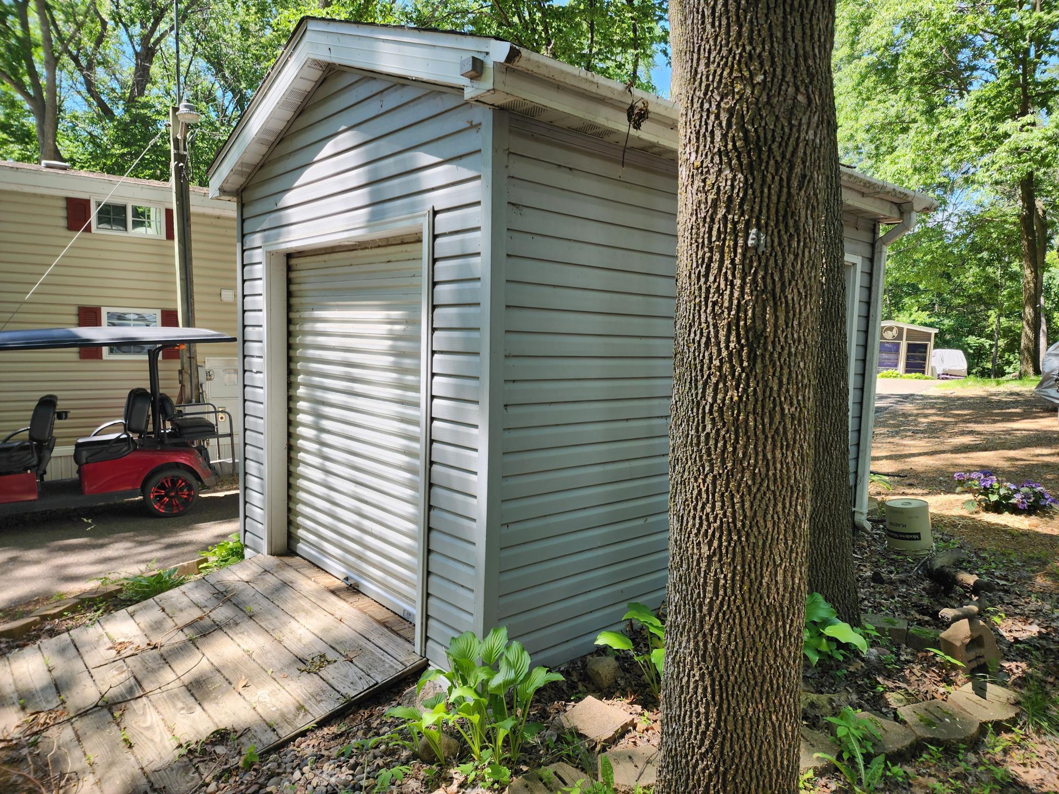 Cokato Lake RV Resort Unit 118 Lofted Park Model, Deck, Shed with peek-a-boo view of Cokato Lake