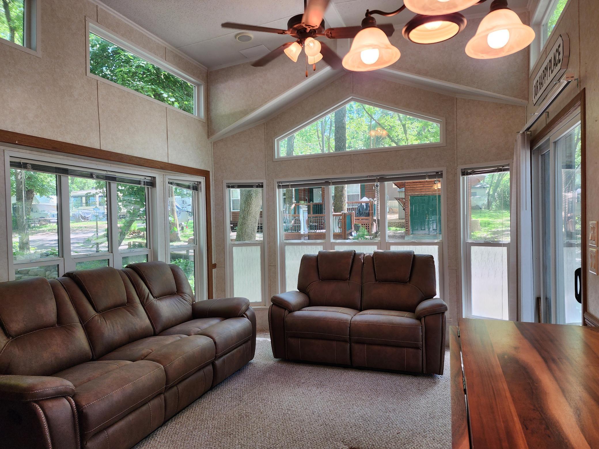 Cokato Lake RV Resort Unit 118 Lofted Park Model, Deck, Shed with peek-a-boo view of Cokato Lake