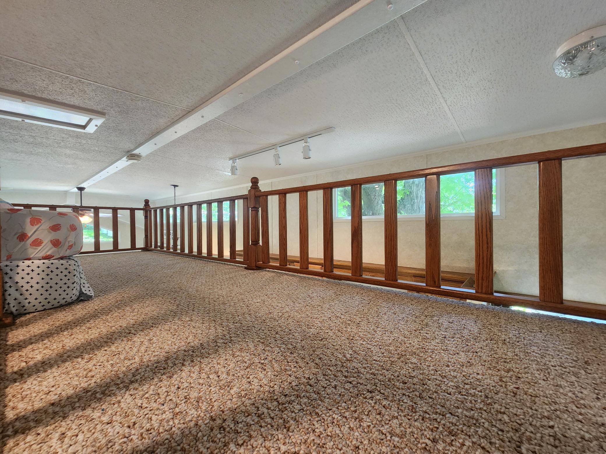 Cokato Lake RV Resort Unit 118 Lofted Park Model, Deck, Shed with peek-a-boo view of Cokato Lake