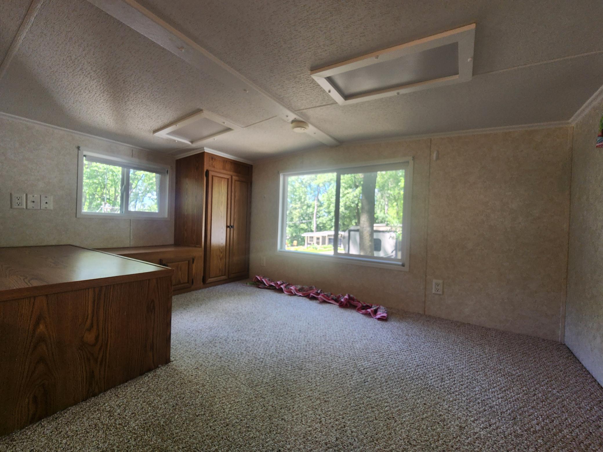 Cokato Lake RV Resort Unit 118 Lofted Park Model, Deck, Shed with peek-a-boo view of Cokato Lake