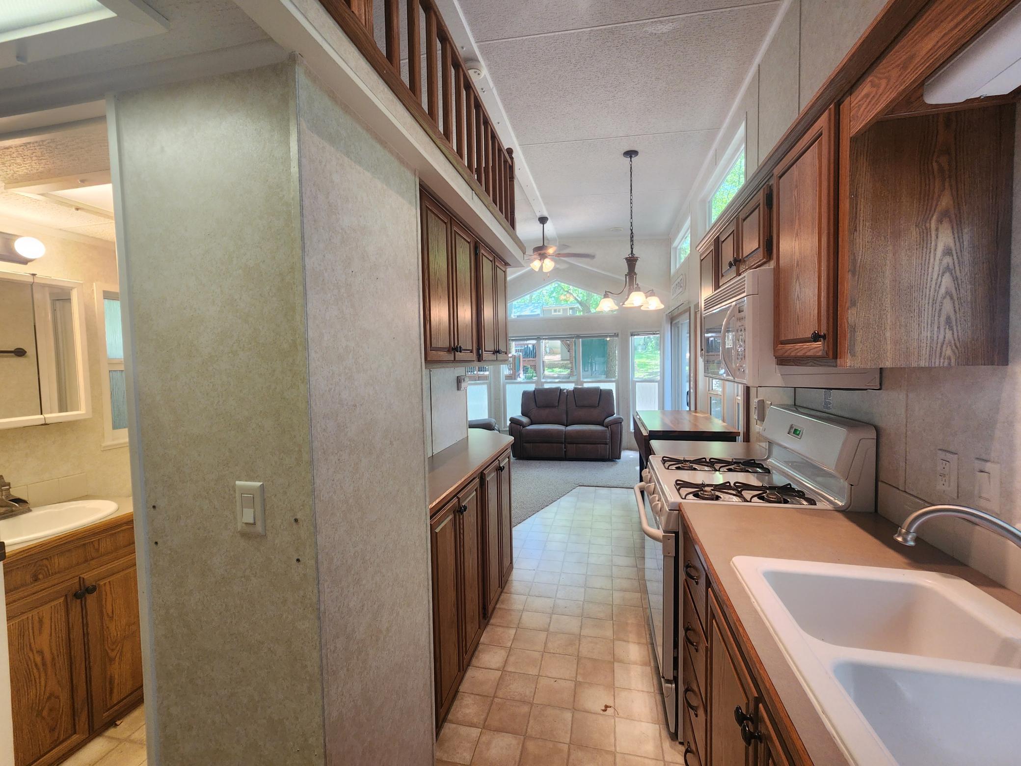 Cokato Lake RV Resort Unit 118 Lofted Park Model, Deck, Shed with peek-a-boo view of Cokato Lake