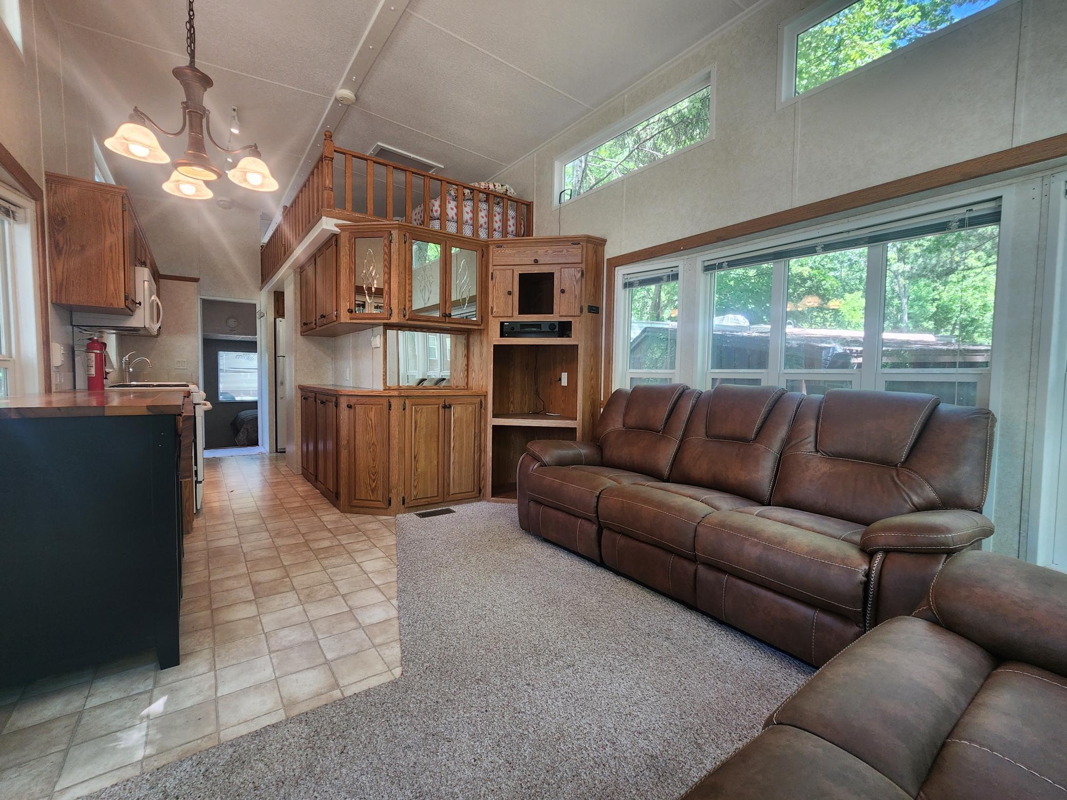 Cokato Lake RV Resort Unit 118 Lofted Park Model, Deck, Shed with peek-a-boo view of Cokato Lake