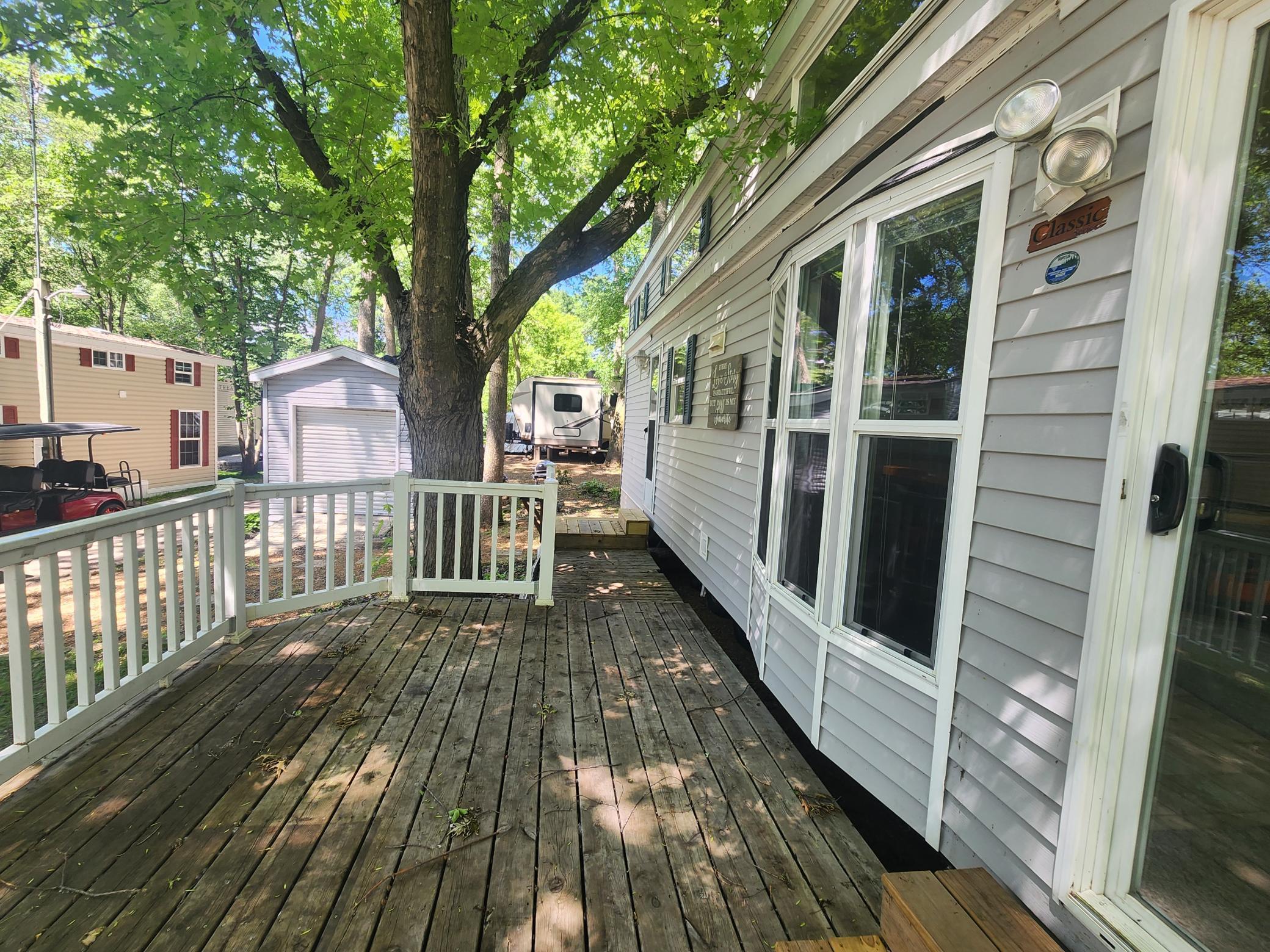 Cokato Lake RV Resort Unit 118 Lofted Park Model, Deck, Shed with peek-a-boo view of Cokato Lake