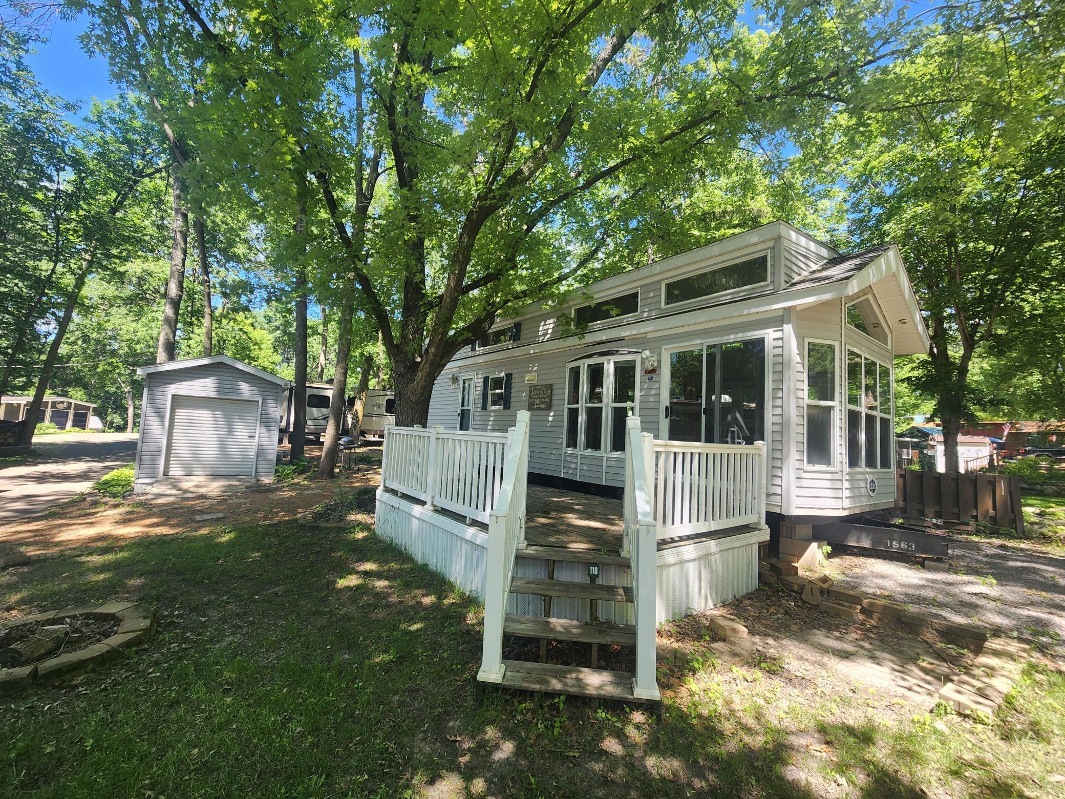 Cokato Lake RV Resort Unit 118 Lofted Park Model, Deck, Shed with peek-a-boo view of Cokato Lake