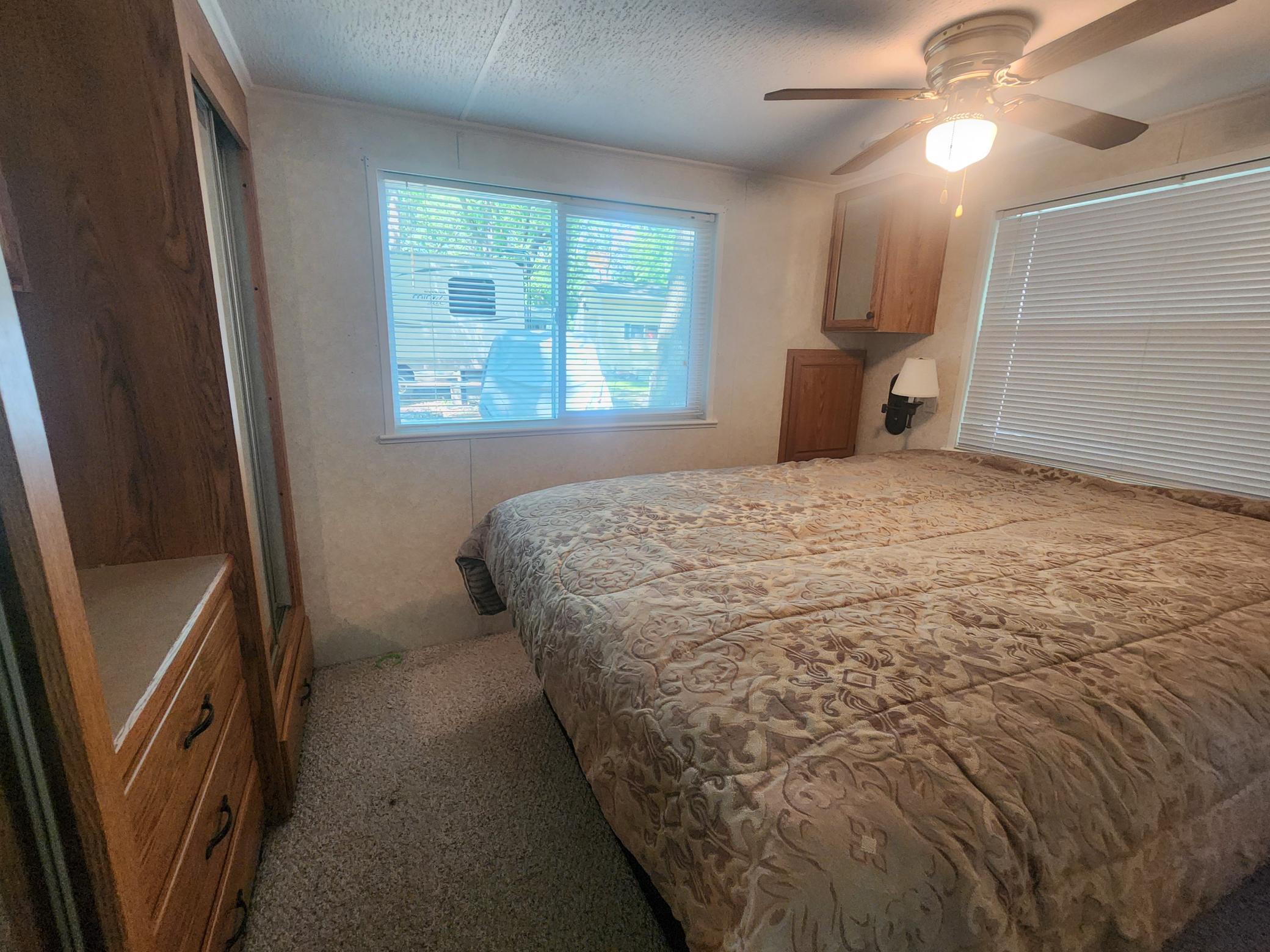 Cokato Lake RV Resort Unit 118 Lofted Park Model, Deck, Shed with peek-a-boo view of Cokato Lake