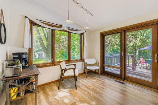 Dining room just off the kitchen and backyard pool.