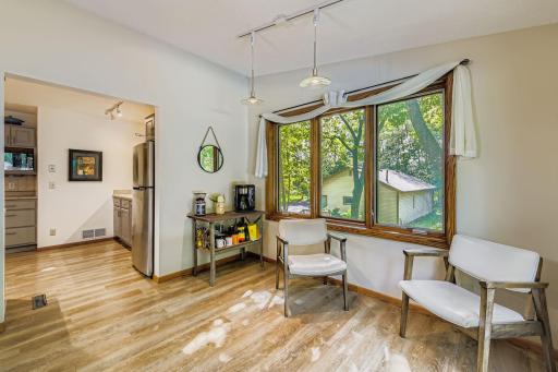 Dining room just off the kitchen and backyard pool.