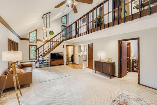 The vaulted ceilings in the living room welcome you to the home.