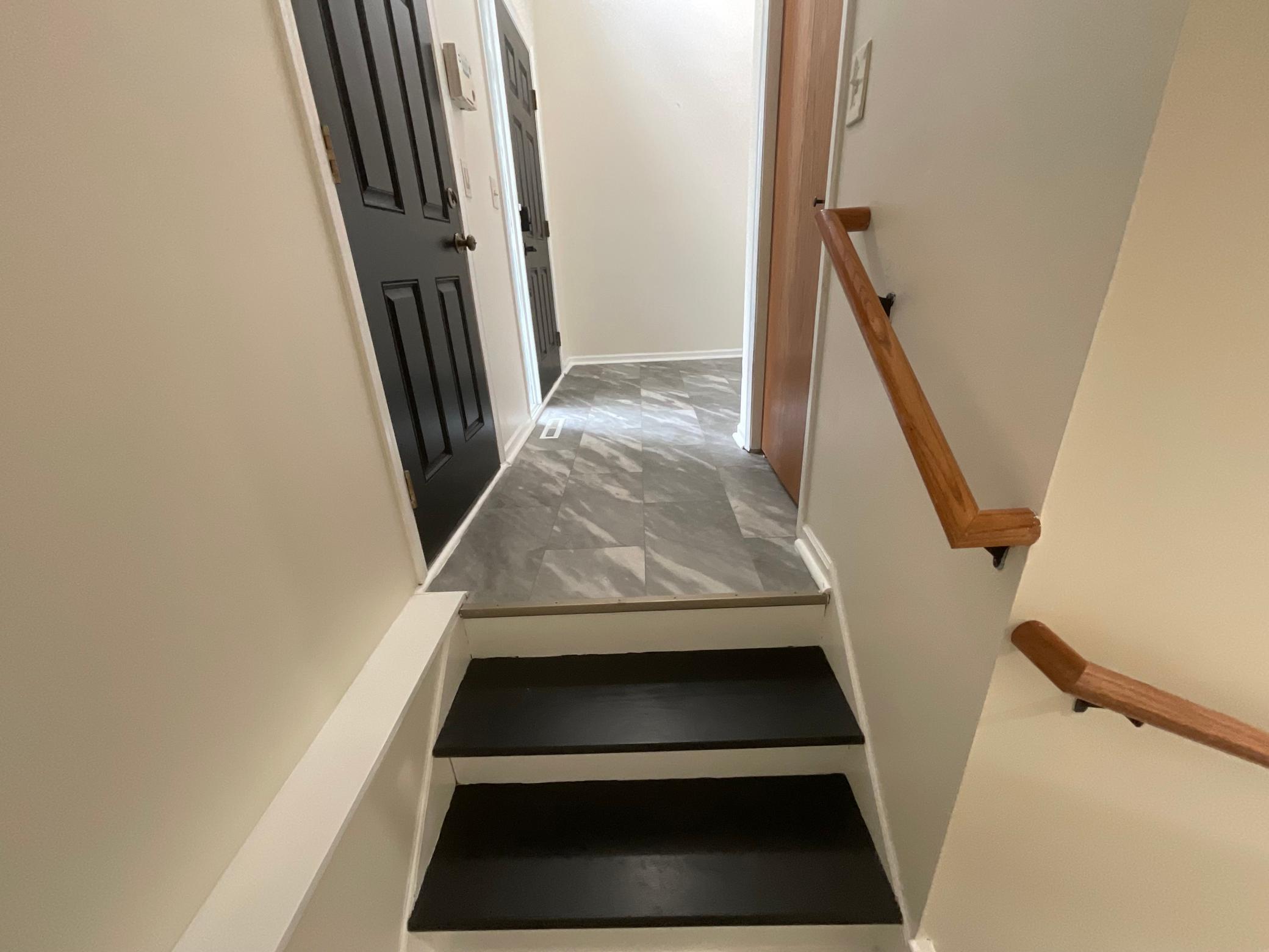 Painted stairs going to lower level