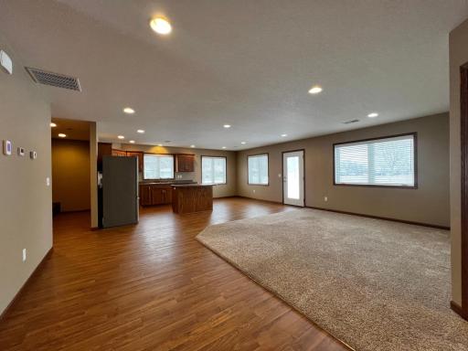 View of Laundry Room, Kitchen, Dining Room, Living Room and Door to back Patio.
