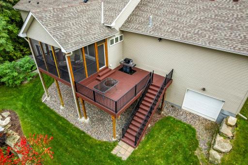 The vaulted screened porch and adjacent deck feature maintenance-free deck material and make a perfect spot to relax and take in the natural scenery.