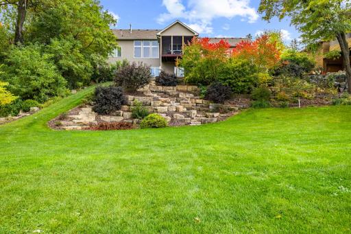 Extensive and costly regrading, tree removal, and landscaping were completed during the removal of the previous home then construction of the new home to create a one-of-a-kind picturesque setting.