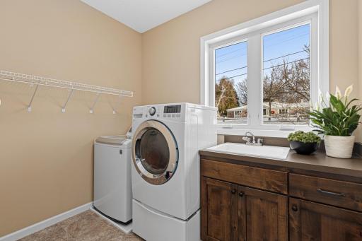 The main floor laundry room is situated just off the mudroom.